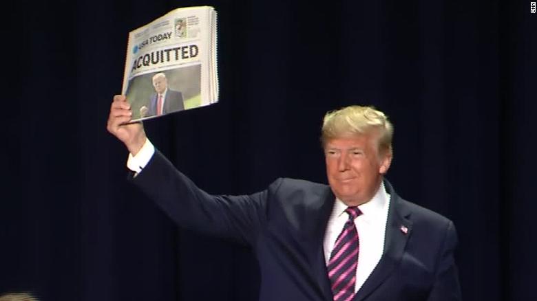 Trump holding paper impeachment